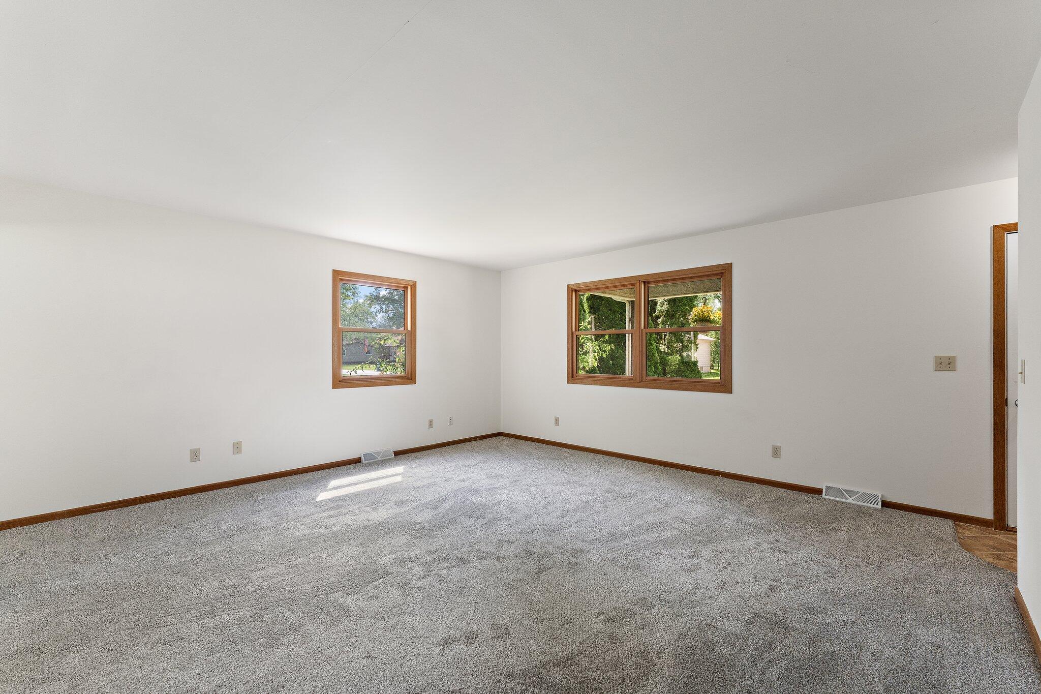 402 Alice Street Kouts, IN 46347 - Photo 8 of 21 an empty room with windows