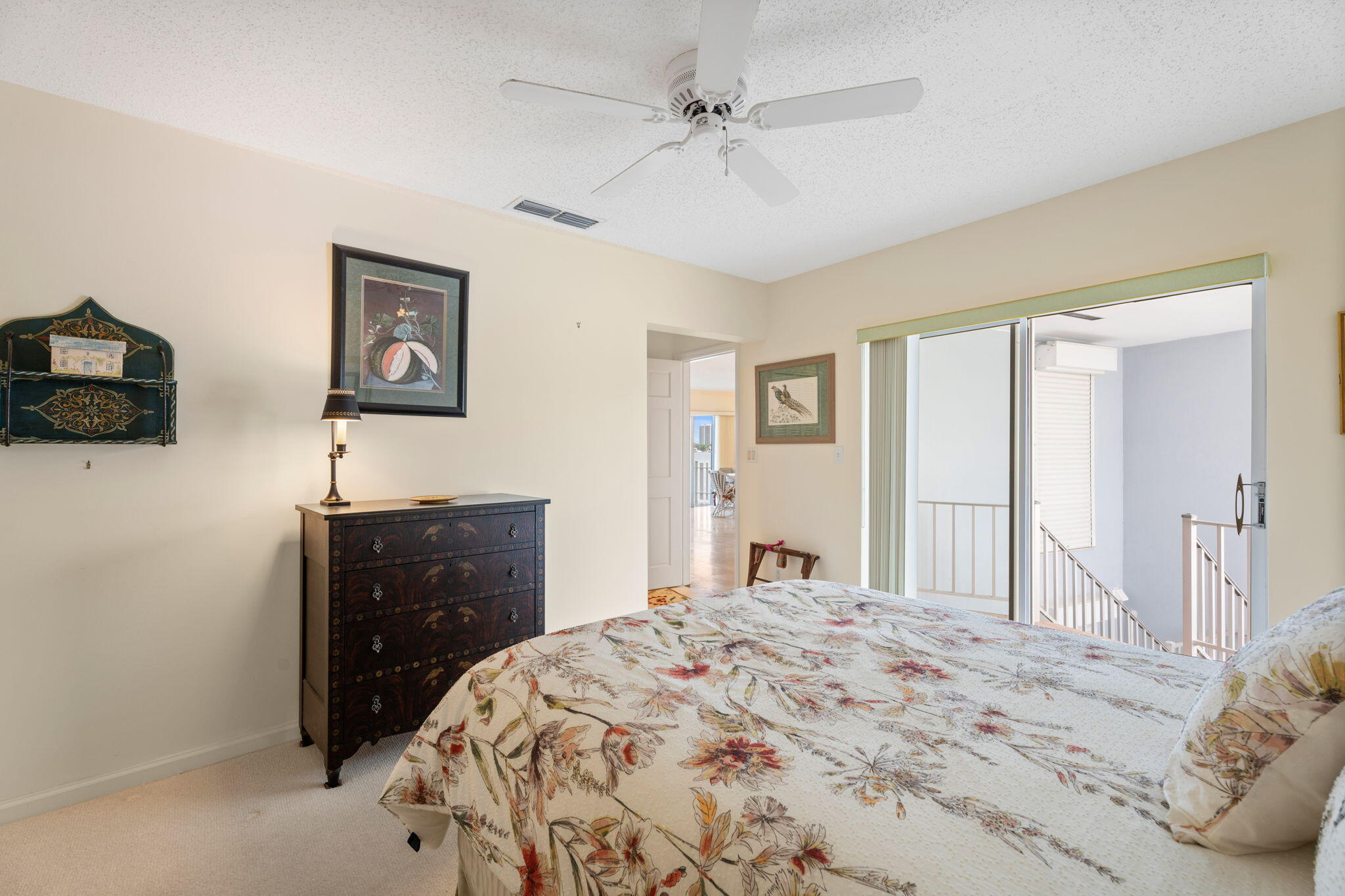 371 Wilma Circle, Unit 5 Riviera Beach, FL 33404 - Photo 14 of 43 a bedroom with a bed and a dresser