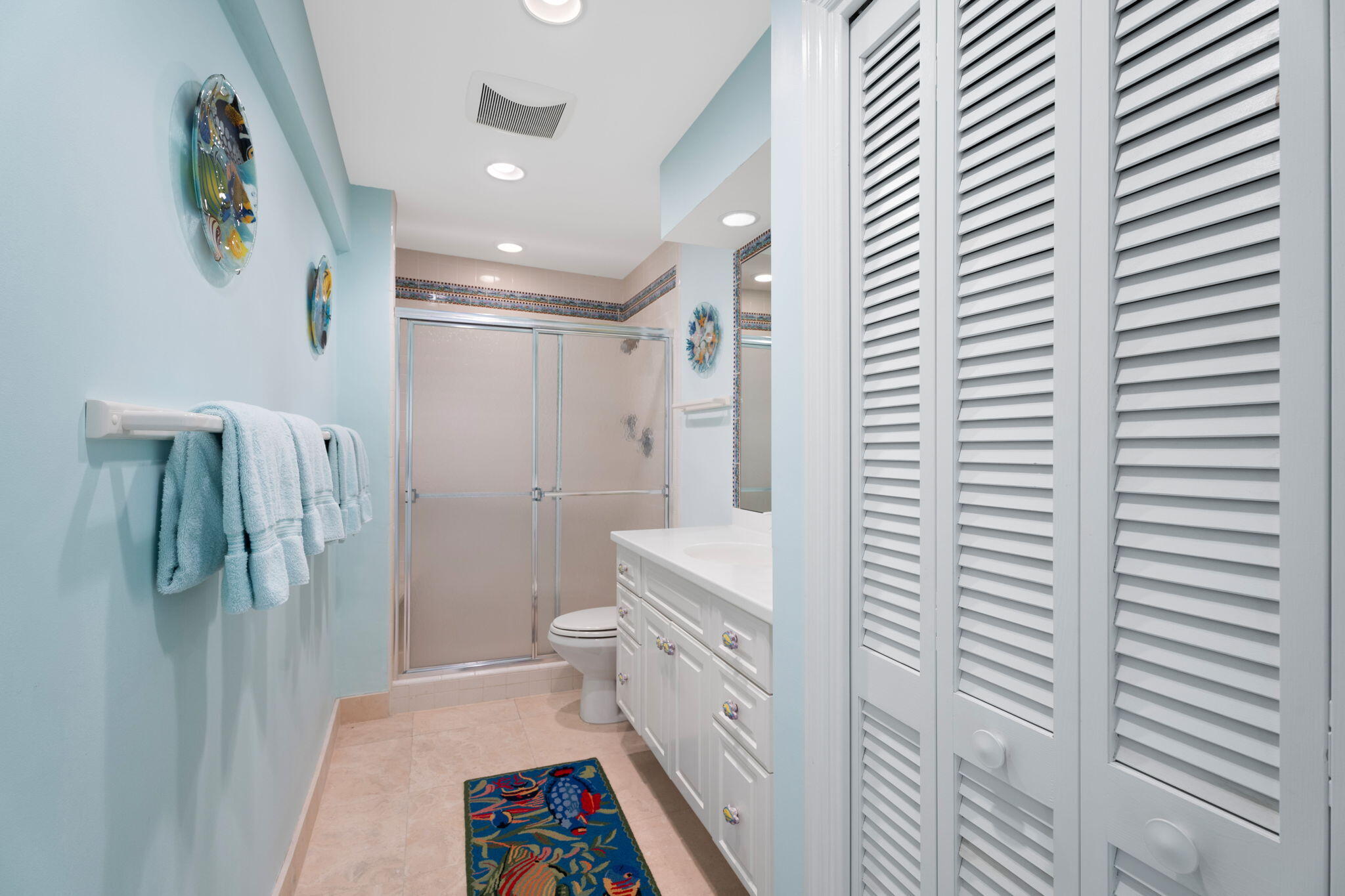 371 Wilma Circle, Unit 5 Riviera Beach, FL 33404 - Photo 15 of 43 a bathroom with a shower and a toilet