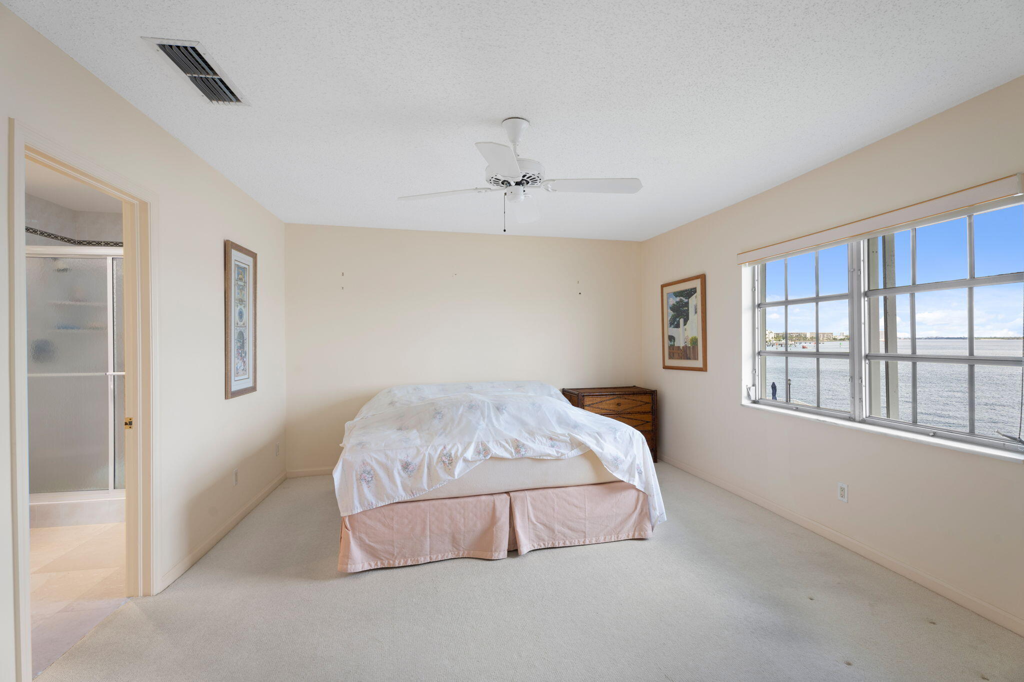371 Wilma Circle, Unit 5 Riviera Beach, FL 33404 - Photo 17 of 43 a bedroom with a bed and a window