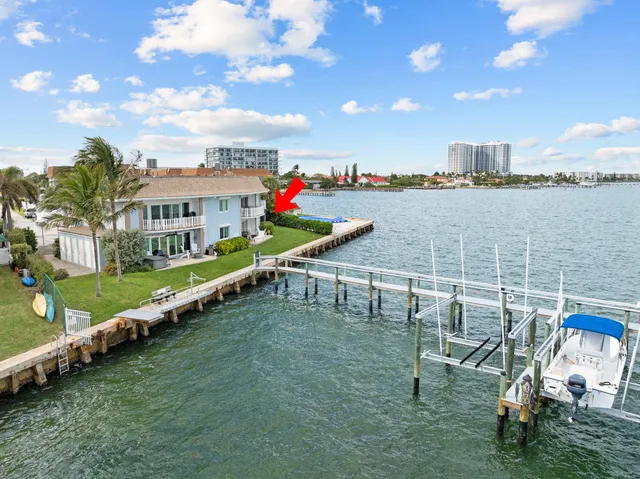 a view of a house with furniture and a garage