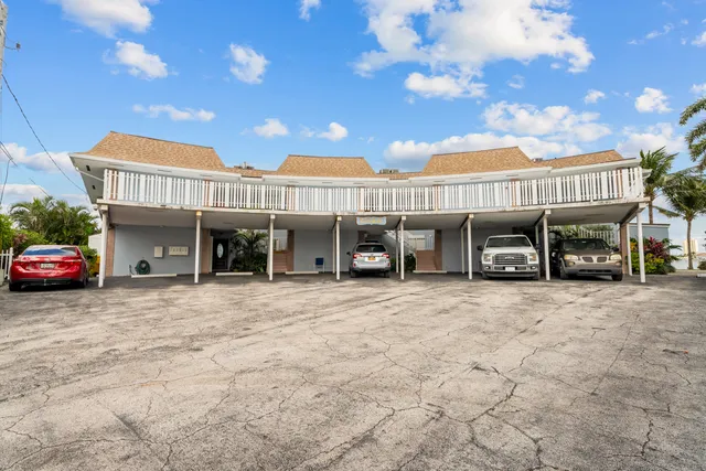 an aerial view of a house with a big yard