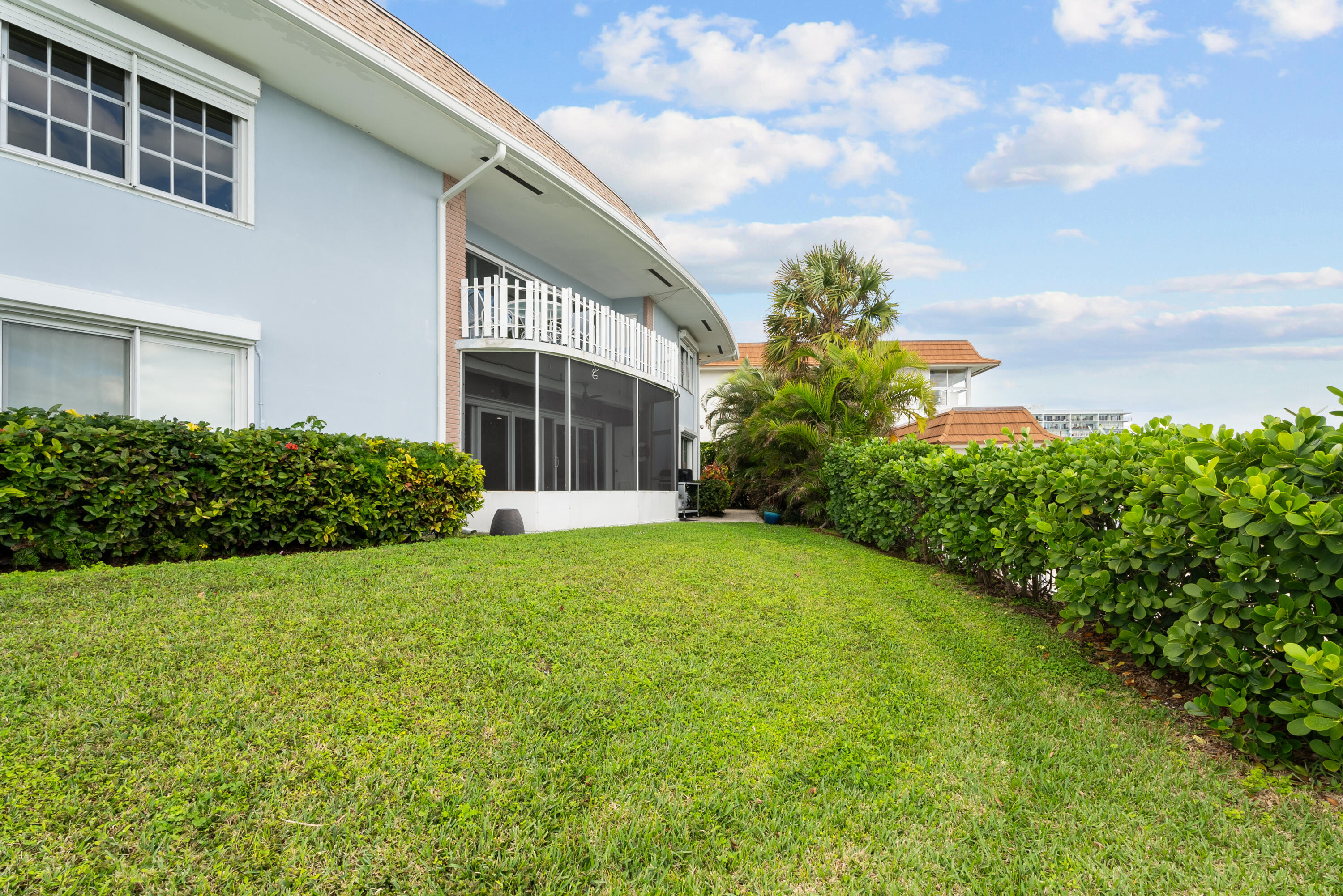 371 Wilma Circle, Unit 5 Riviera Beach, FL 33404 - Photo 32 of 43 a view of a house with a garden