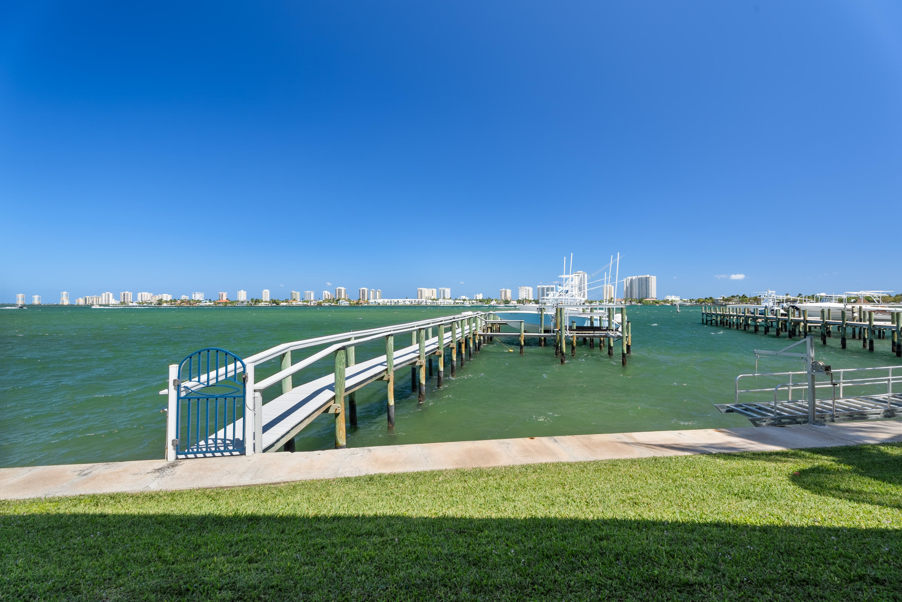 371 Wilma Circle, Unit 5 Riviera Beach, FL 33404 - Photo 37 of 43 a view of a house with a yard