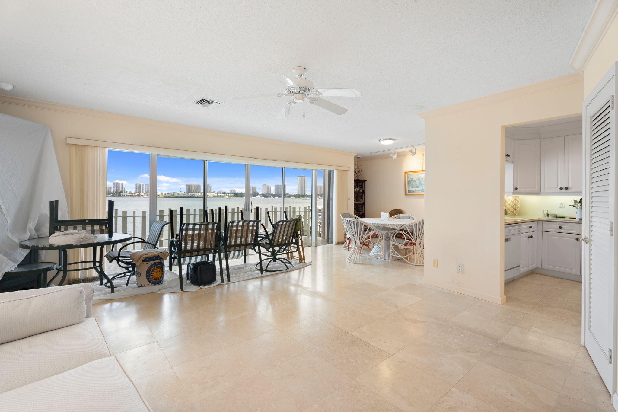 371 Wilma Circle, Unit 5 Riviera Beach, FL 33404 - Photo 5 of 43 a view of a living room a patio and a chandelier