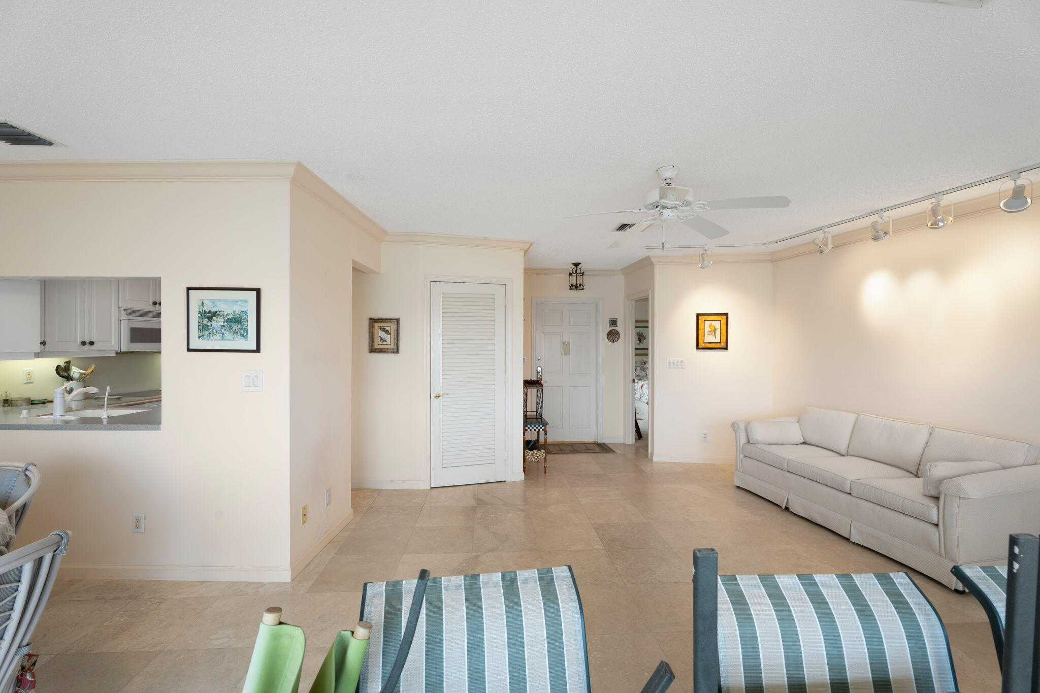 371 Wilma Circle, Unit 5 Riviera Beach, FL 33404 - Photo 8 of 43 a living room with furniture and wooden floor