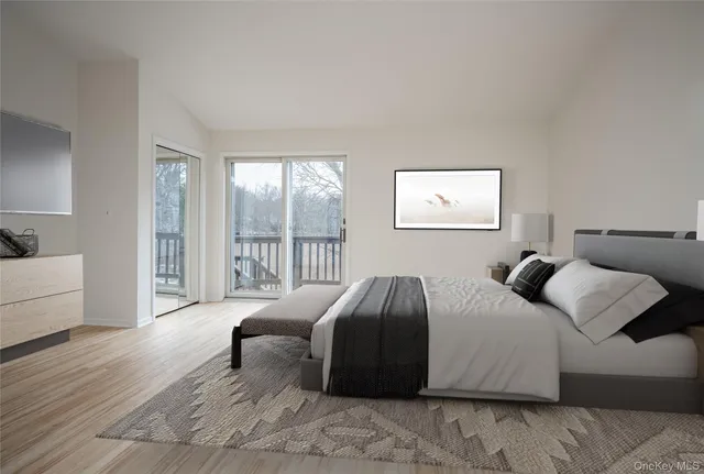 a bedroom with a bed and glass window