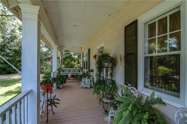 3381 Blazer Road Franklin, TN 37064 - Photo 4 of 20 a view of a porch with chairs and potted plants