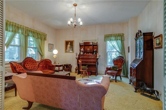 3381 Blazer Road Franklin, TN 37064 - Photo 6 of 20 a living room with fireplace furniture and a chandelier