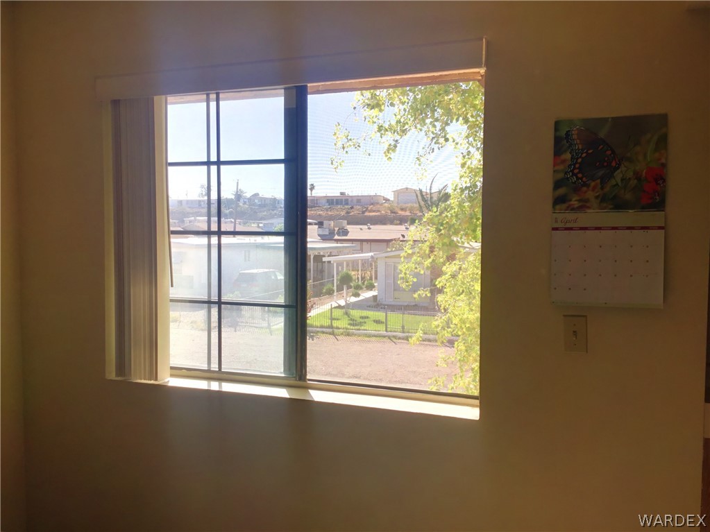 1190 Ramar Road Bullhead City, AZ 86442 - Photo 11 of 32 a view of an empty room with a window