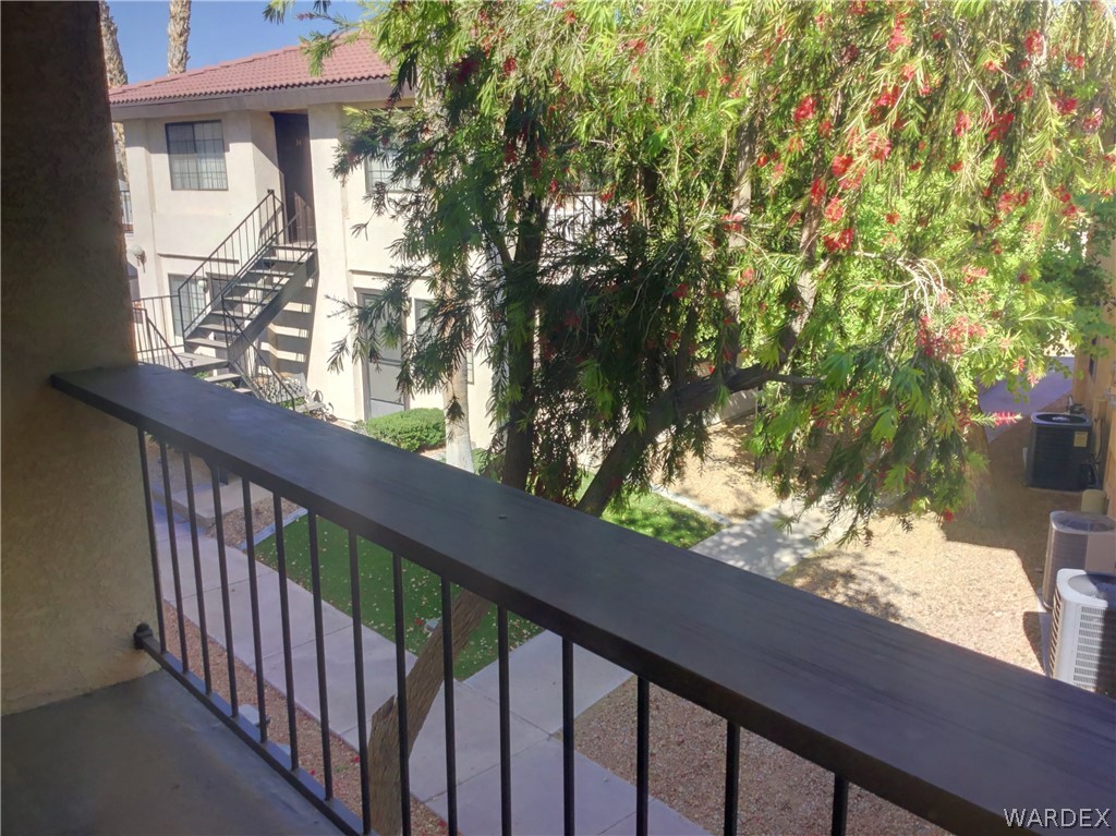 1190 Ramar Road Bullhead City, AZ 86442 - Photo 14 of 32 a view of a balcony with wooden fence