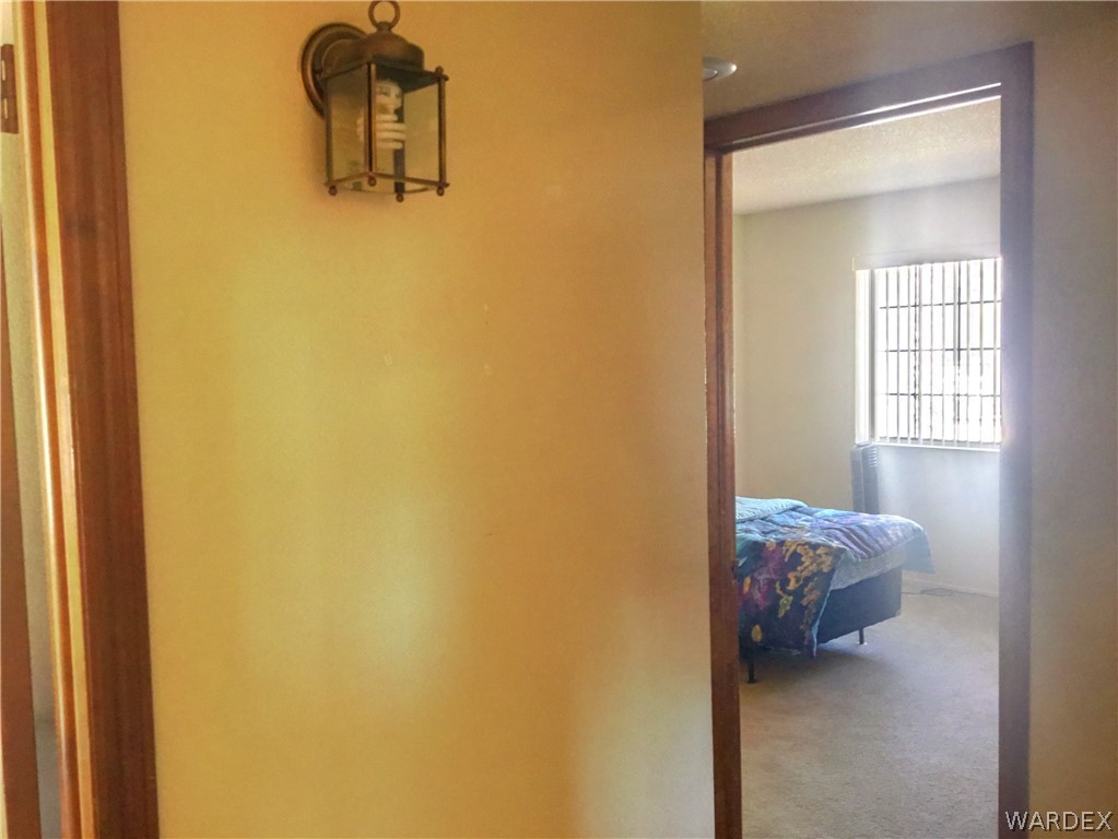 1190 Ramar Road Bullhead City, AZ 86442 - Photo 15 of 32 a bed room with a bed and a window