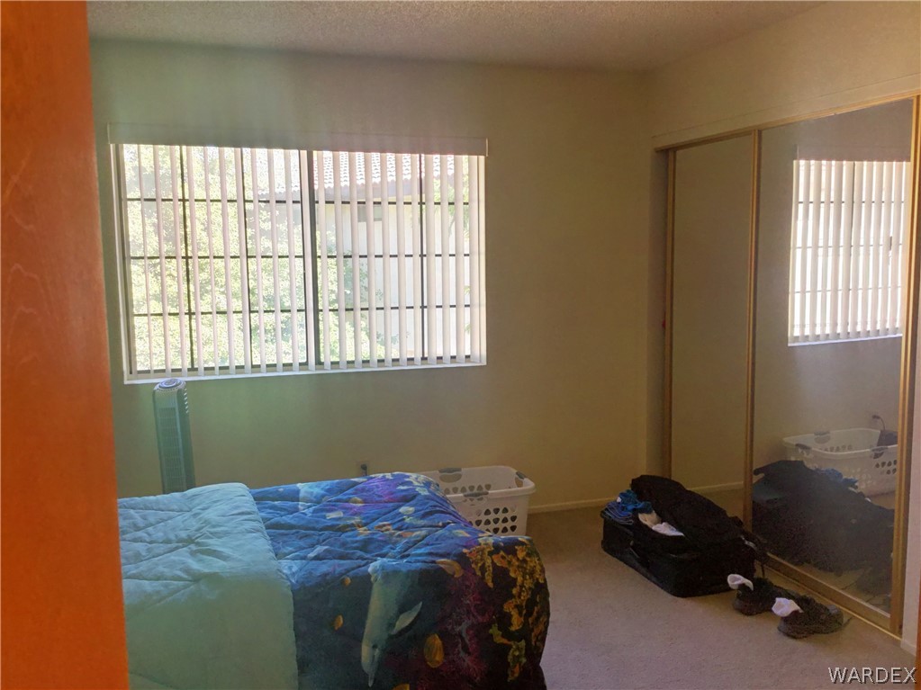 1190 Ramar Road Bullhead City, AZ 86442 - Photo 16 of 32 a bedroom with a bed and a window