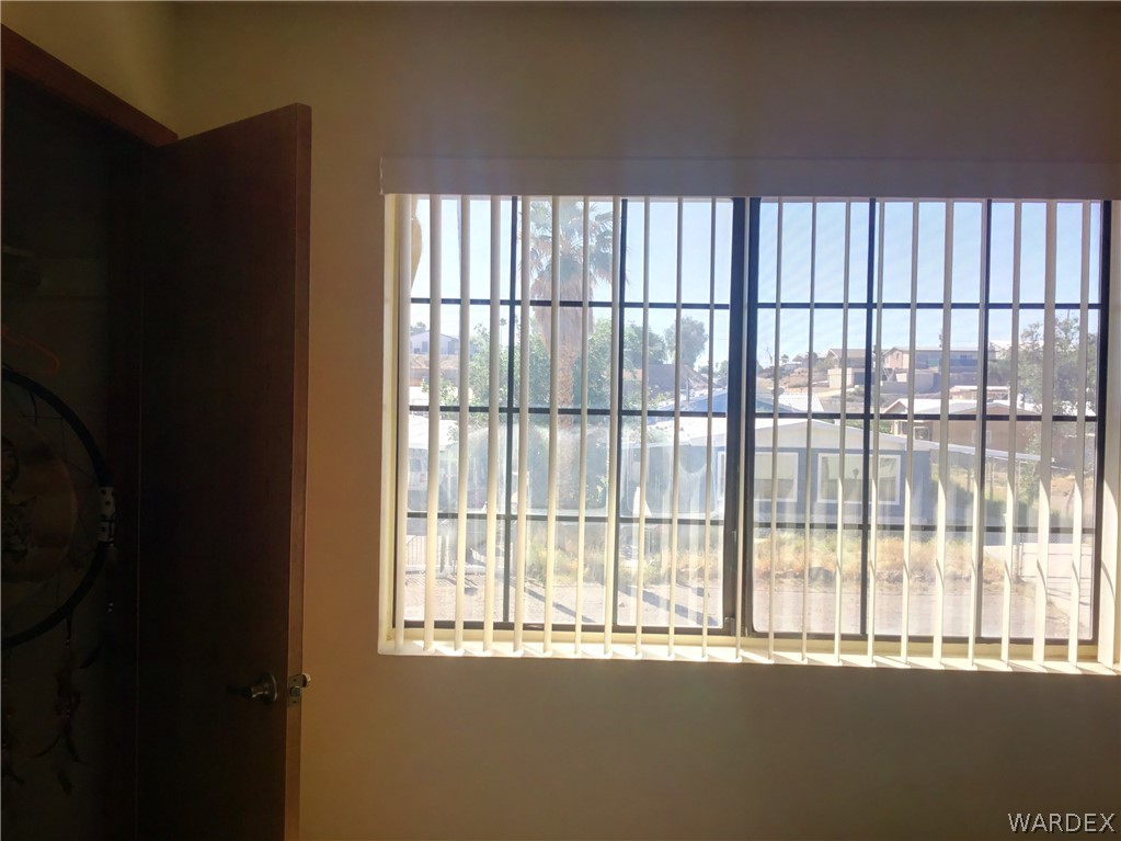 1190 Ramar Road Bullhead City, AZ 86442 - Photo 20 of 32 a view of an empty room with a window