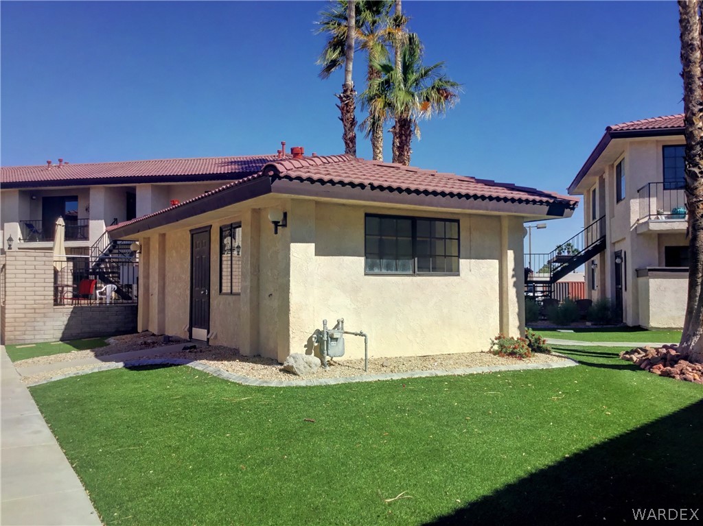 1190 Ramar Road Bullhead City, AZ 86442 - Photo 29 of 32 a view of a house with backyard