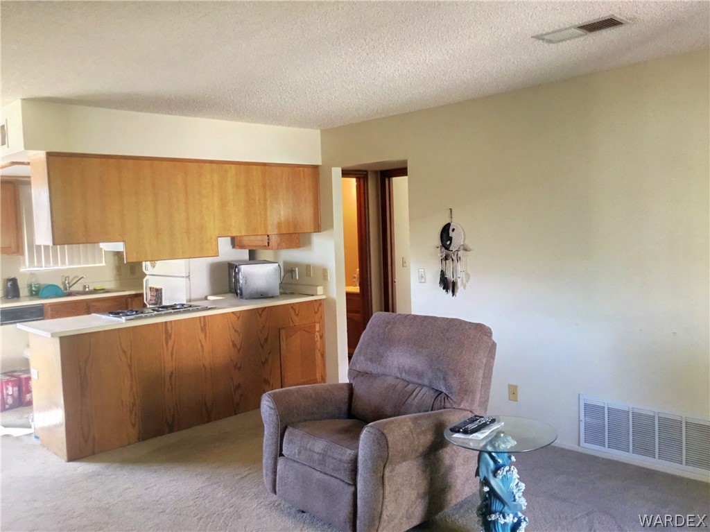 1190 Ramar Road Bullhead City, AZ 86442 - Photo 6 of 32 a living room with furniture and a window