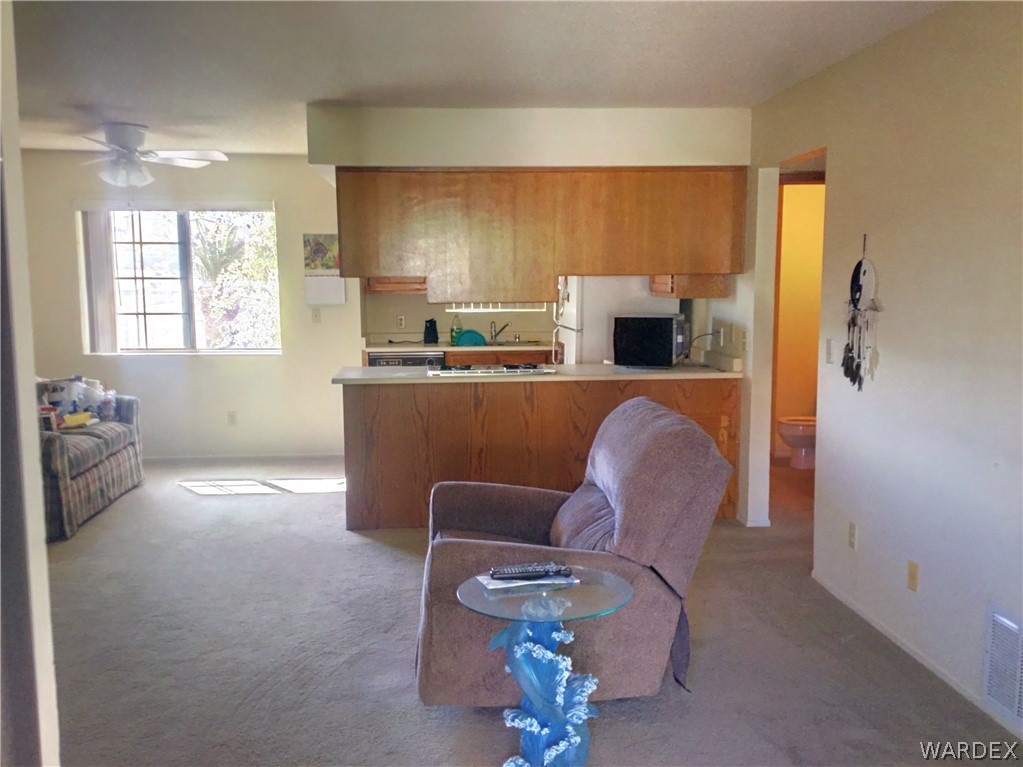 1190 Ramar Road Bullhead City, AZ 86442 - Photo 7 of 32 a living room with furniture and a large window