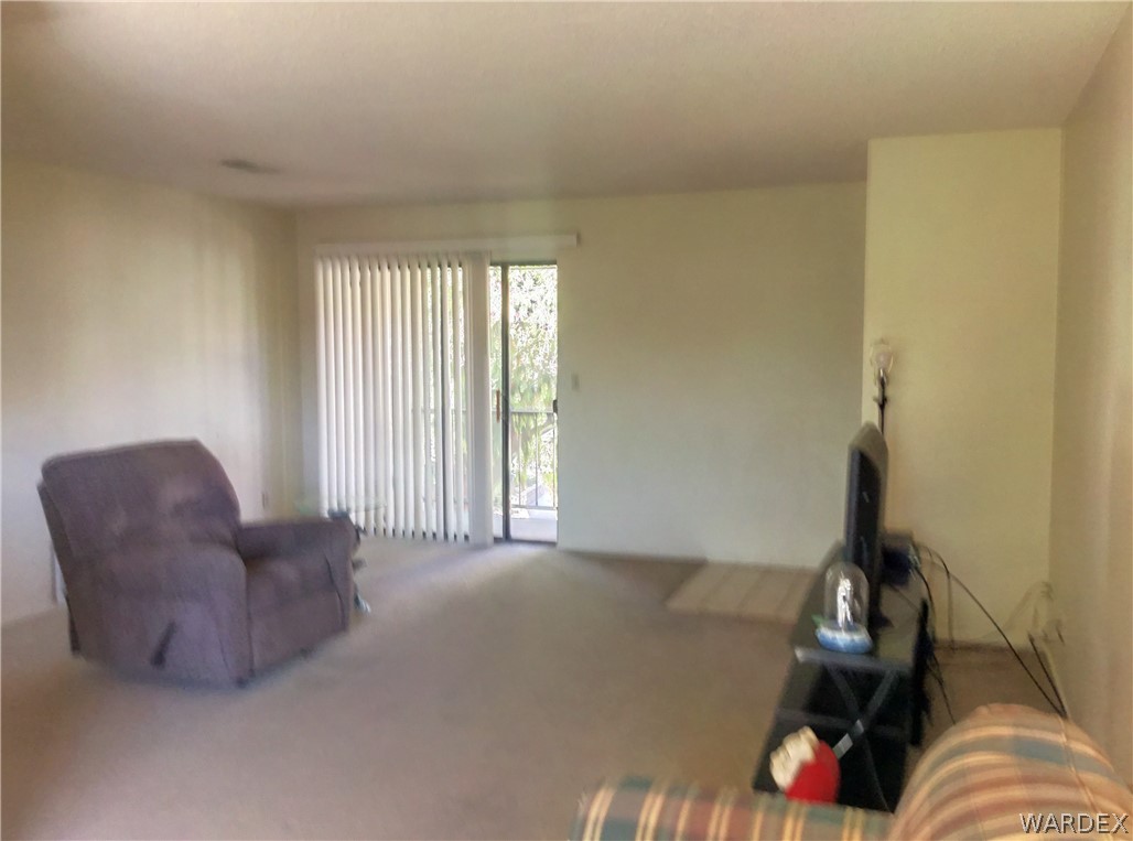 1190 Ramar Road Bullhead City, AZ 86442 - Photo 8 of 32 a living room with furniture and a window