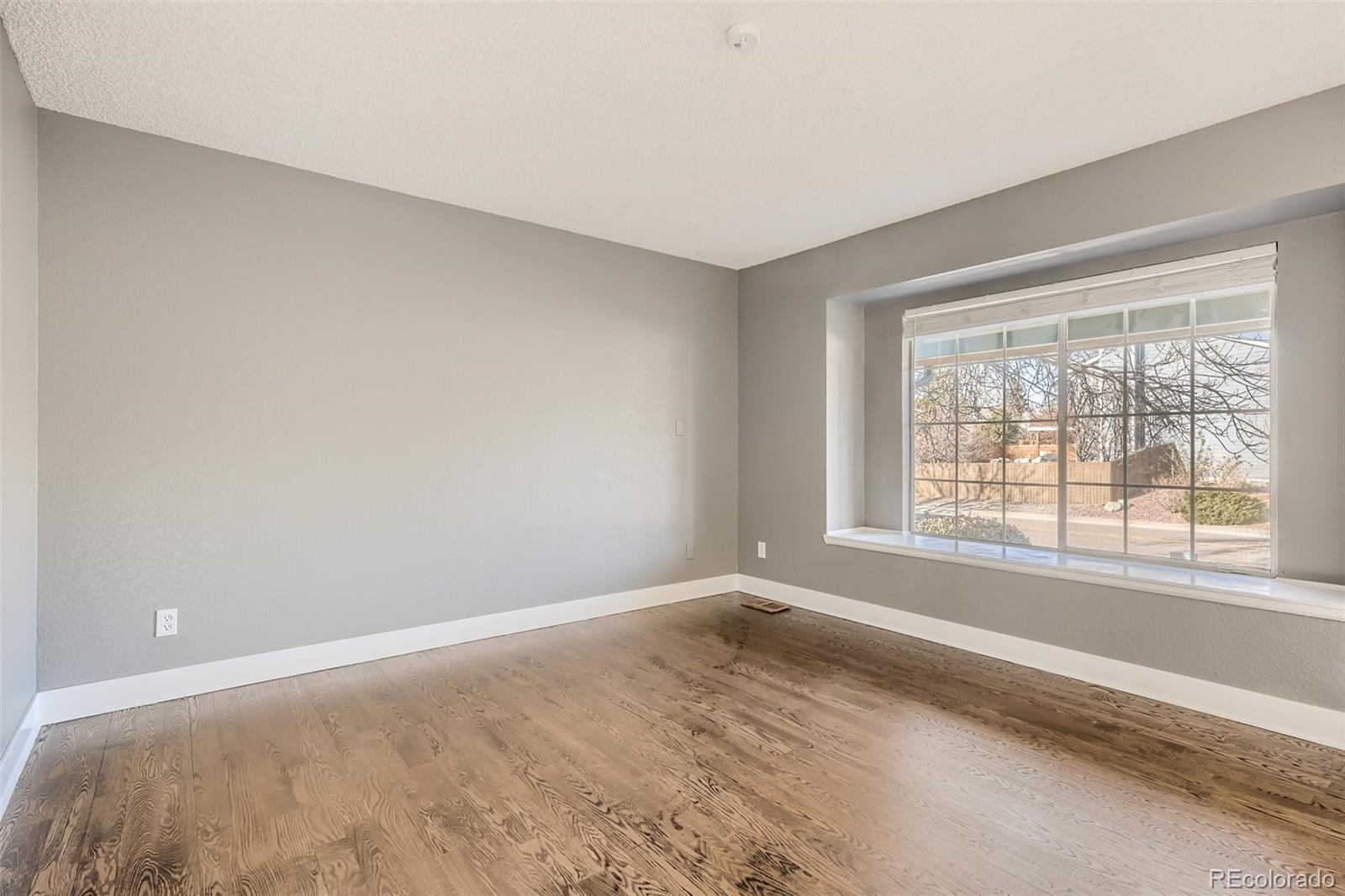 642 Northridge Road Highlands Ranch, CO 80126 - Photo 11 of 31 a view of a bedroom with a window