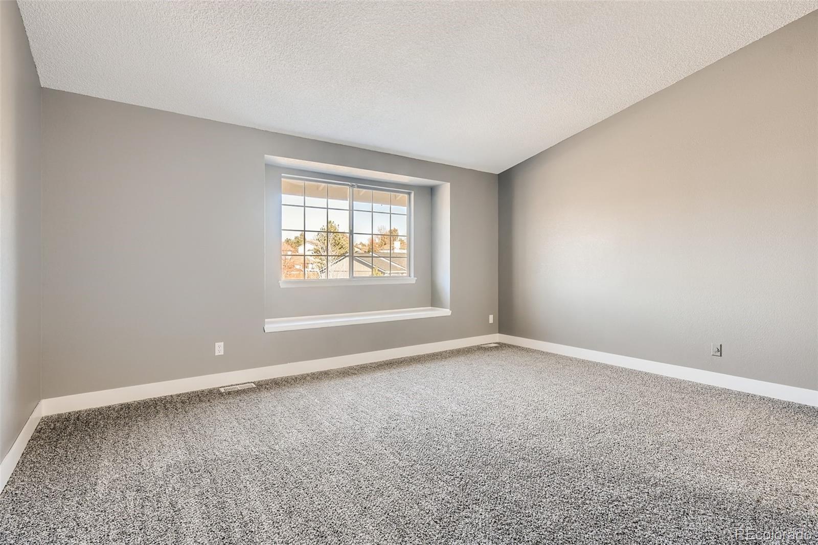 642 Northridge Road Highlands Ranch, CO 80126 - Photo 19 of 31 an empty room with a window