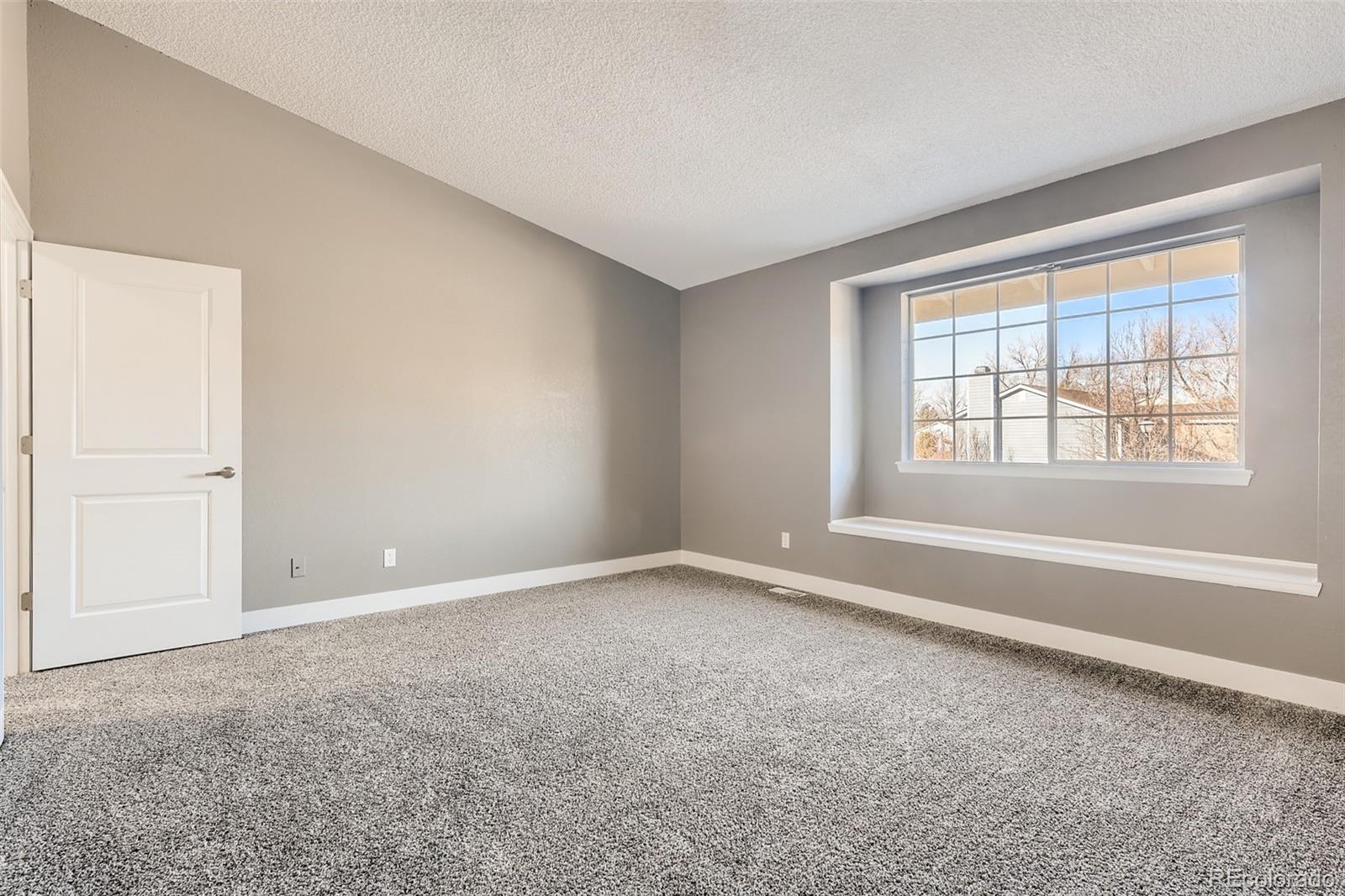 642 Northridge Road Highlands Ranch, CO 80126 - Photo 20 of 31 an empty room with windows