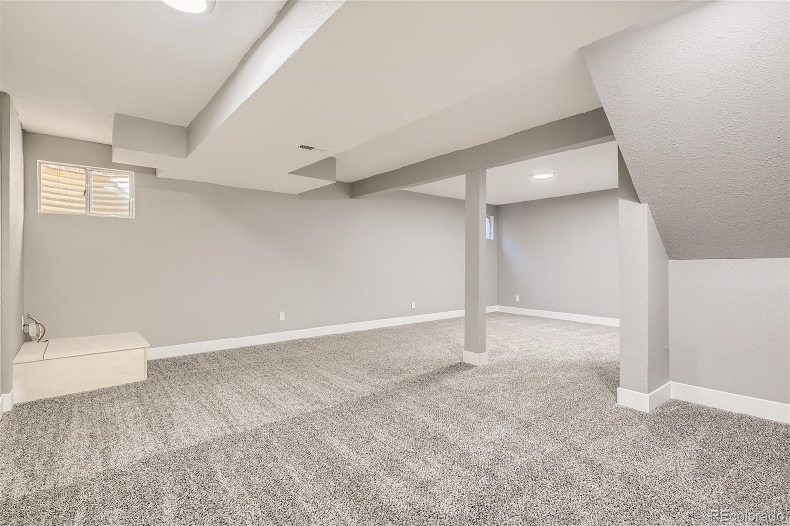 642 Northridge Road Highlands Ranch, CO 80126 - Photo 26 of 31 a view of an empty room with a window
