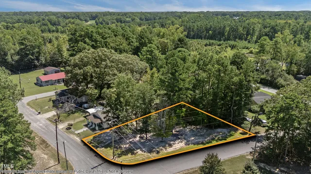 a view of a small pool with a yard