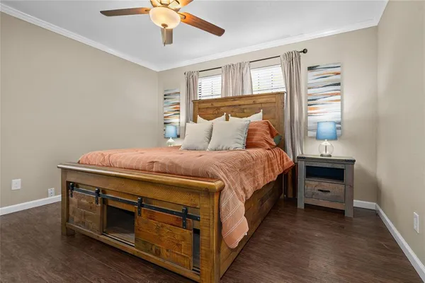 a bedroom with a bed and a dresser