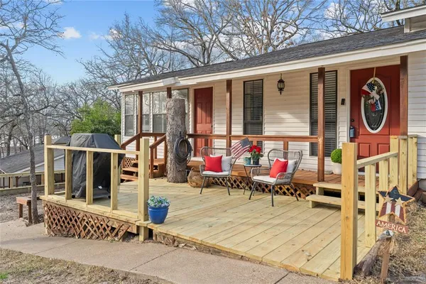 a view of a dinning room with wooden floor and wooden fence
