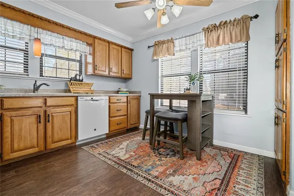 a kitchen with sink cabinets and window