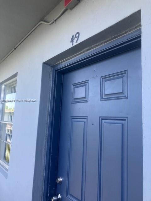 4250 Southwest 67th Avenue, Unit 49 Miami, FL 33155 - Photo 3 of 11 a front view of a house