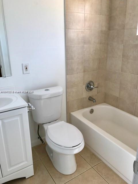 4250 Southwest 67th Avenue, Unit 49 Miami, FL 33155 - Photo 8 of 11 a white toilet and tub sitting next to a bathroom sink