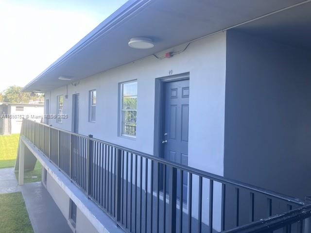4250 Southwest 67th Avenue, Unit 49 Miami, FL 33155 - Photo 9 of 11 a view of a hallway with window