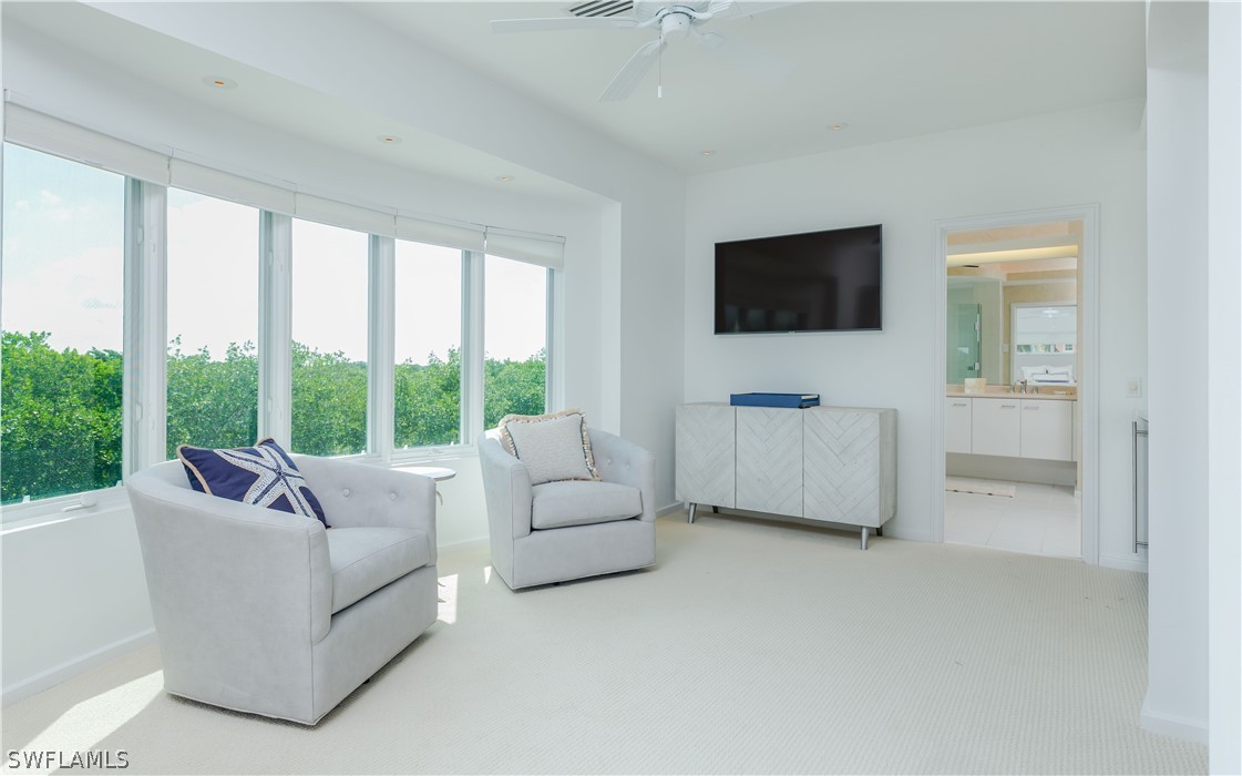 591 Rum Road Captiva, FL 33924 - Photo 11 of 34 a living room with furniture and a flat screen tv