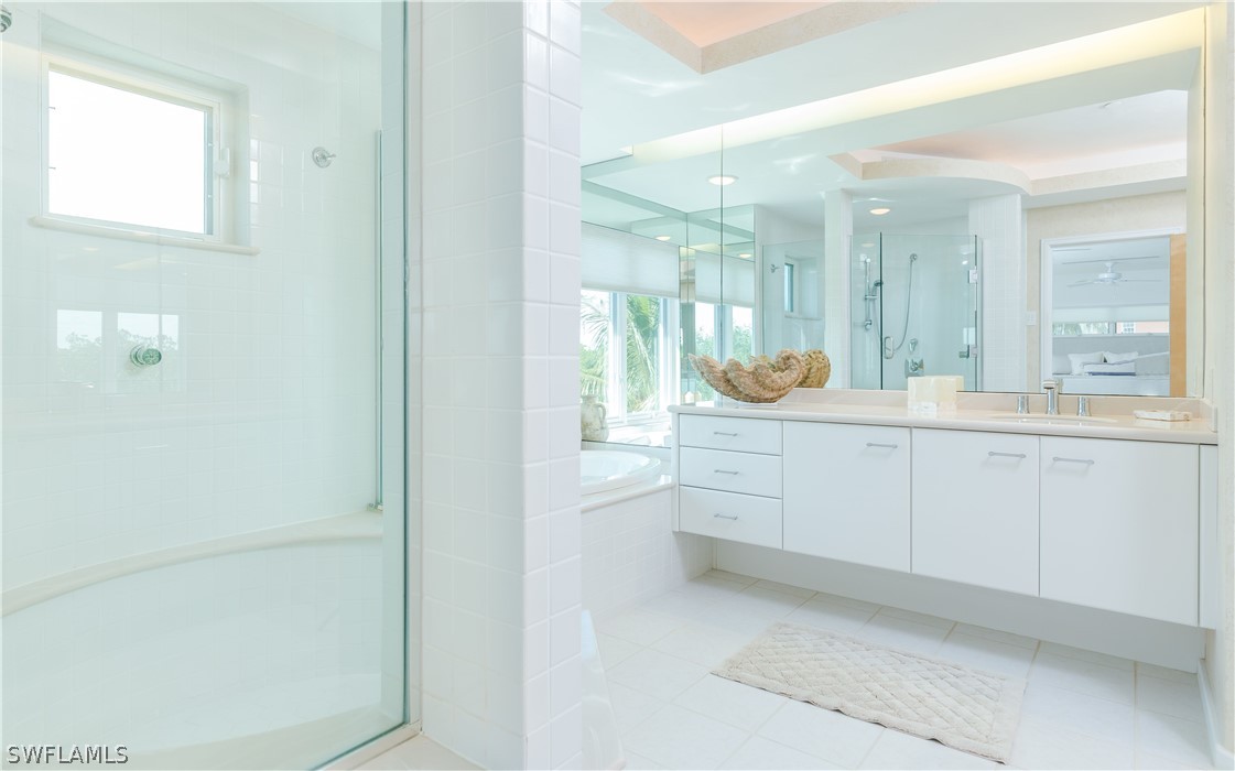 591 Rum Road Captiva, FL 33924 - Photo 13 of 34 a bathroom with a granite countertop sink mirror and window