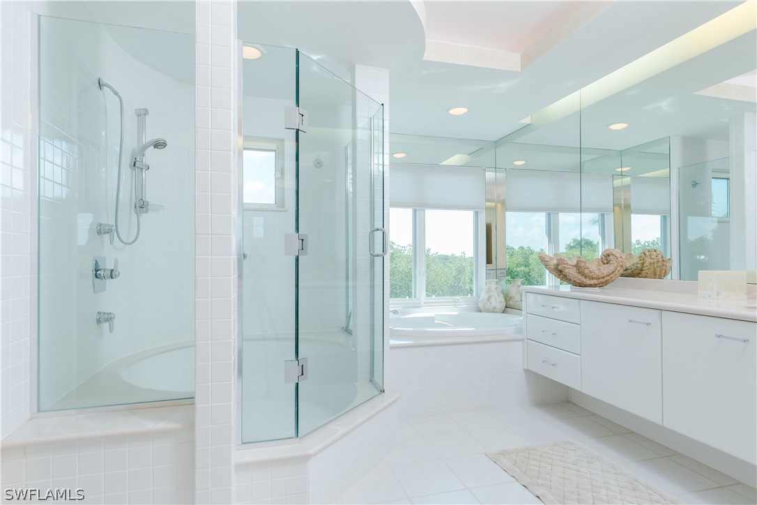 591 Rum Road Captiva, FL 33924 - Photo 14 of 34 a bathroom with a shower sink and mirror