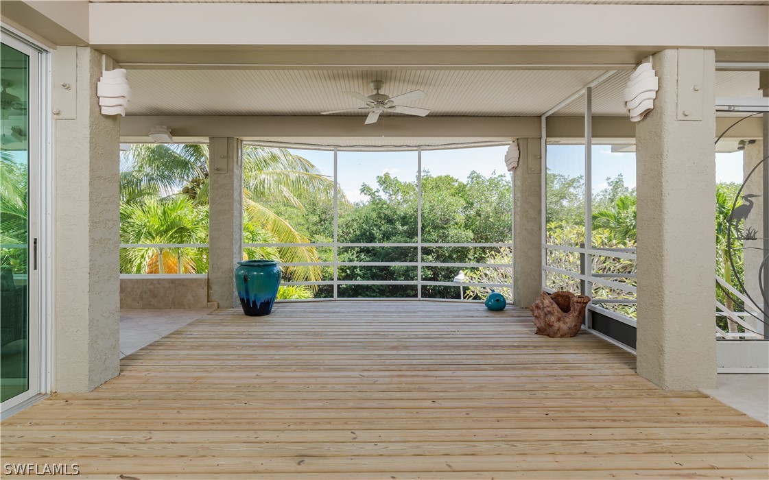 591 Rum Road Captiva, FL 33924 - Photo 17 of 34 a view of a room with wooden floor and balcony
