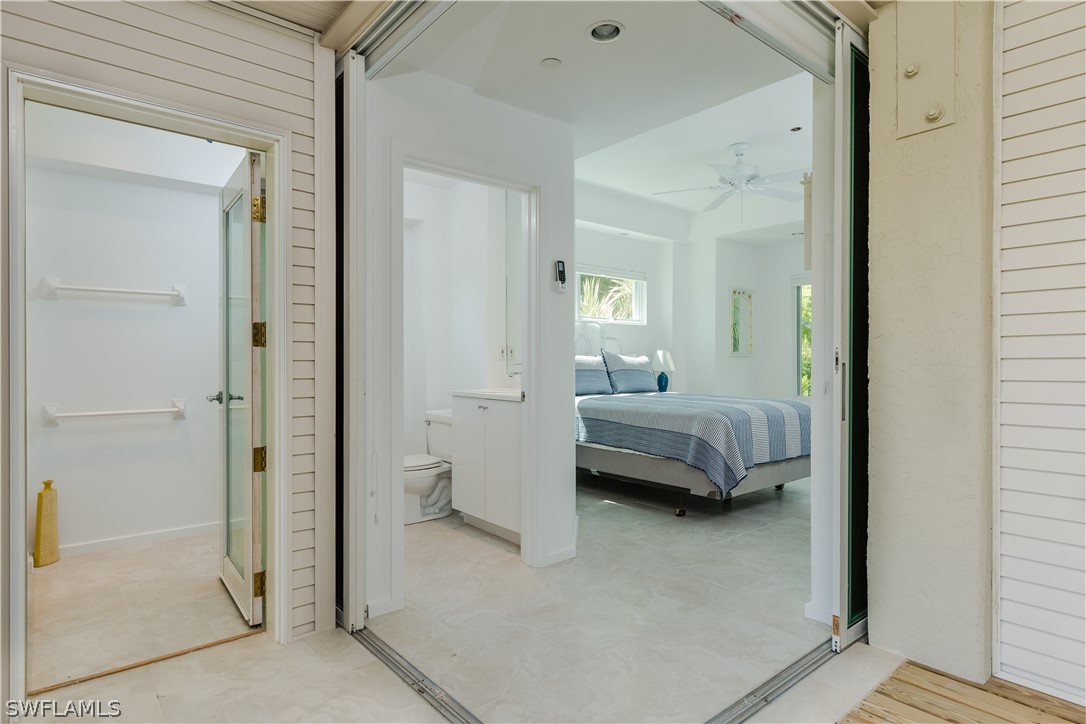 591 Rum Road Captiva, FL 33924 - Photo 20 of 34 a en suite bathroom with a tub and shower