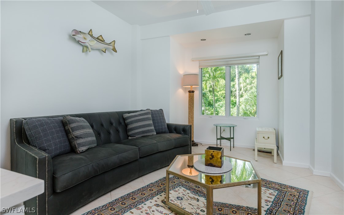 591 Rum Road Captiva, FL 33924 - Photo 23 of 34 a living room with furniture and a window