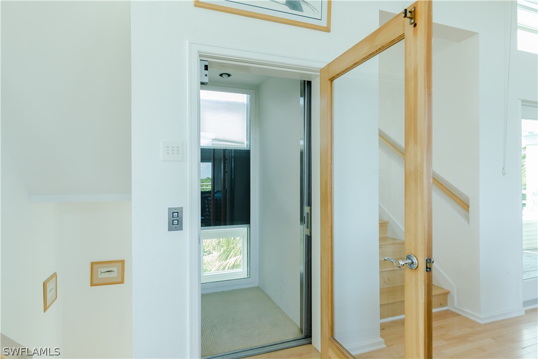 591 Rum Road Captiva, FL 33924 - Photo 24 of 34 a view of front door with wooden floor