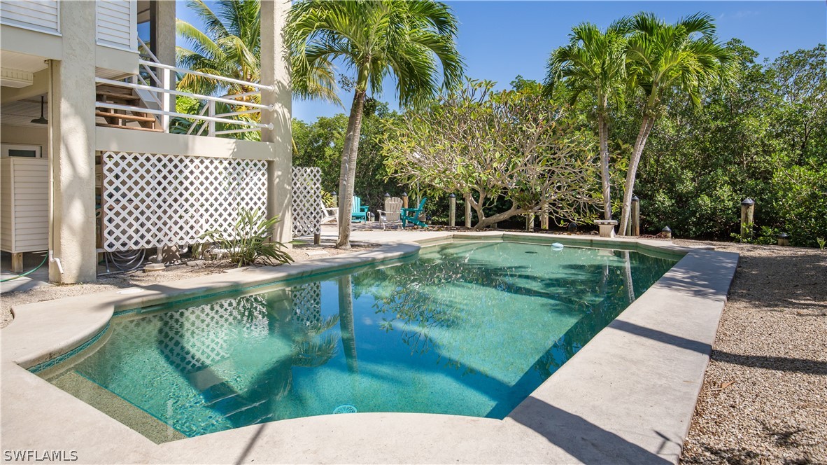 591 Rum Road Captiva, FL 33924 - Photo 25 of 34 a view of a backyard with a garden
