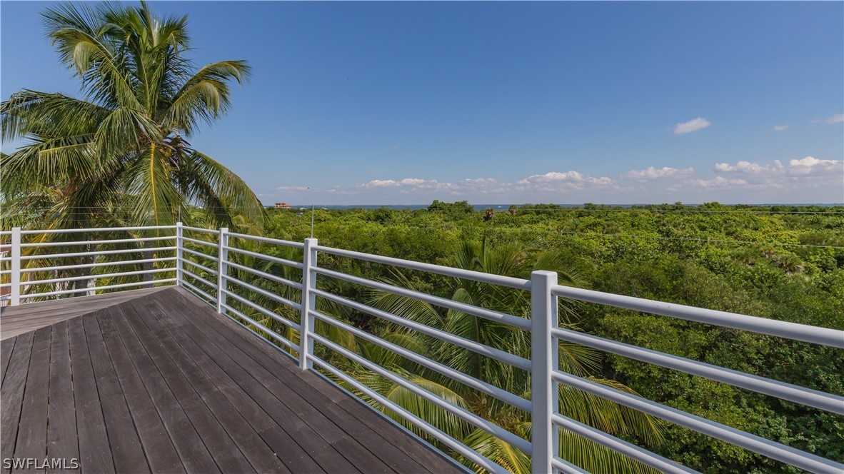591 Rum Road Captiva, FL 33924 - Photo 27 of 34 a view of a yard with wooden floor and fence
