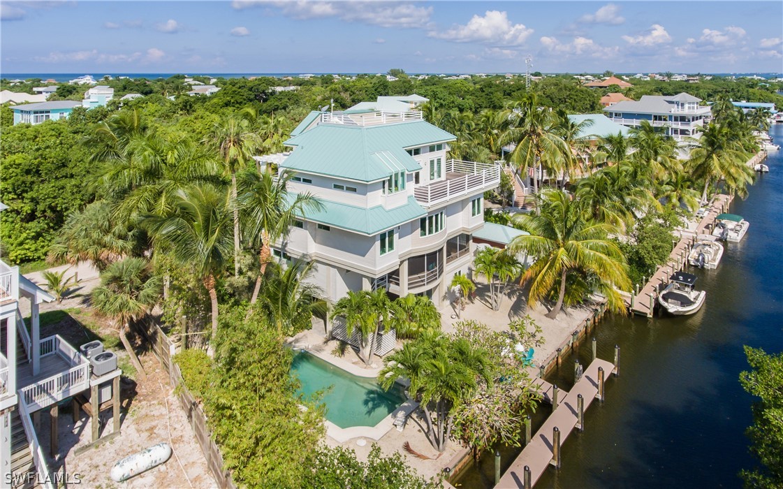 591 Rum Road Captiva, FL 33924 - Photo 29 of 34 a aerial view of a house with a yard and garden in the back