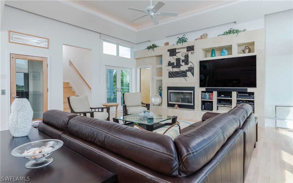 591 Rum Road Captiva, FL 33924 - Photo 4 of 34 a living room with furniture and a flat screen tv