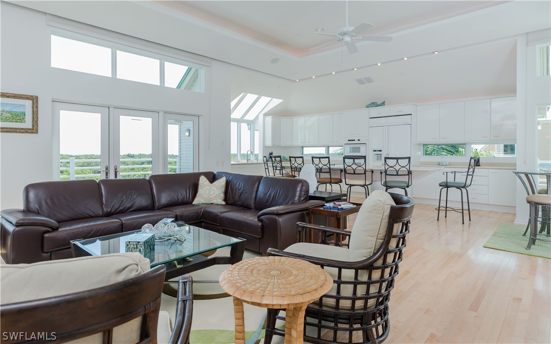 591 Rum Road Captiva, FL 33924 - Photo 5 of 34 a living room with furniture and a large window