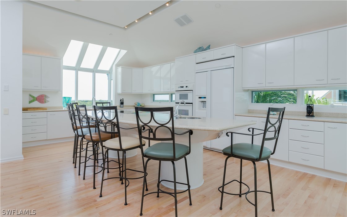 591 Rum Road Captiva, FL 33924 - Photo 6 of 34 a view of a dining room with furniture and windows