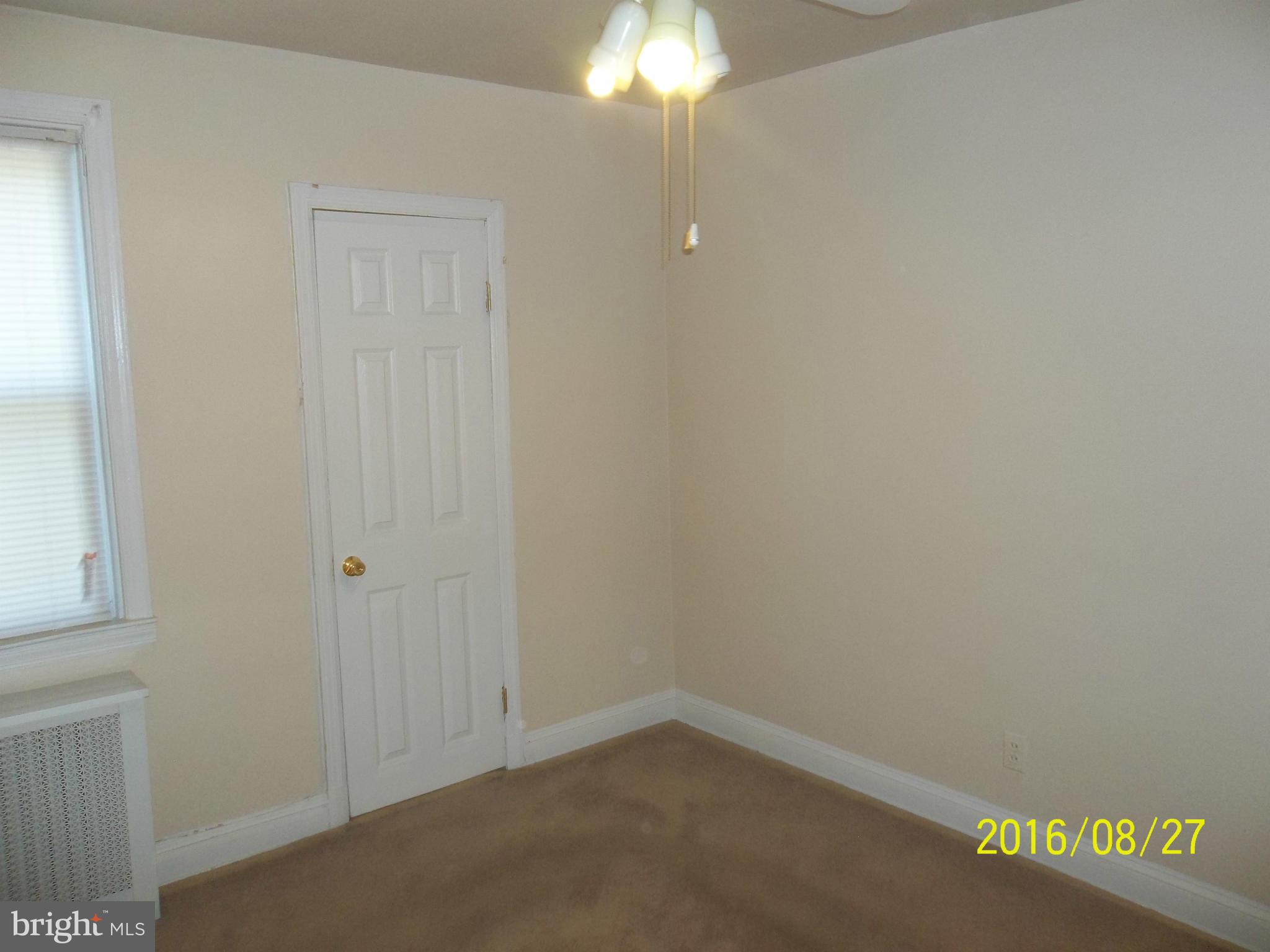 3810 Flowerton Road Baltimore, MD 21229 - Photo 12 of 20 a room that has a window in it