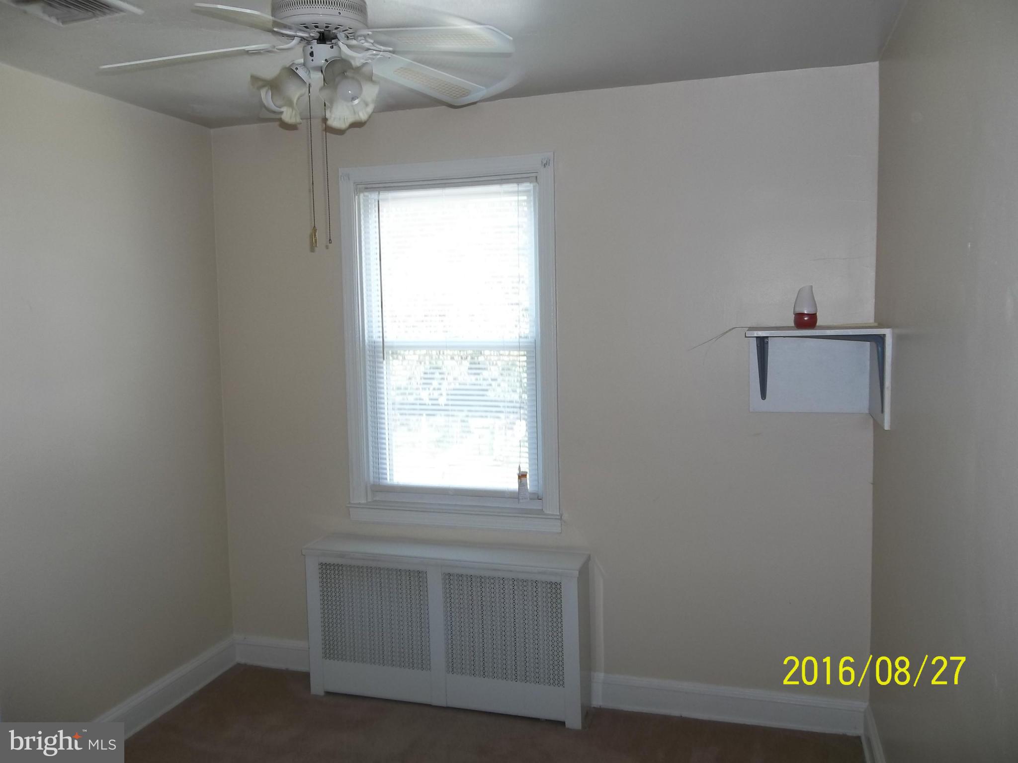 3810 Flowerton Road Baltimore, MD 21229 - Photo 14 of 20 an empty room with a window