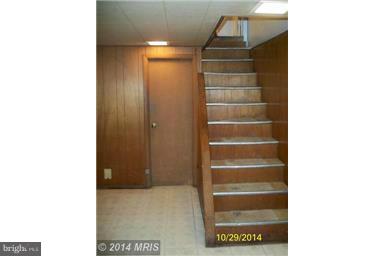 3810 Flowerton Road Baltimore, MD 21229 - Photo 16 of 20 a view of walk in closet with empty shelves