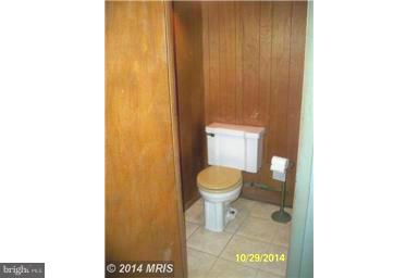 3810 Flowerton Road Baltimore, MD 21229 - Photo 19 of 20 a bathroom with a toilet and a shower